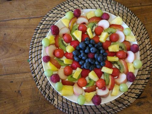 a bowl of fruit on a plate on a table at Bowden House B&B in Melrose