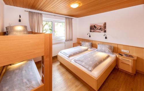 Ένα ή περισσότερα κρεβάτια σε δωμάτιο στο Elto Appartements Chalet