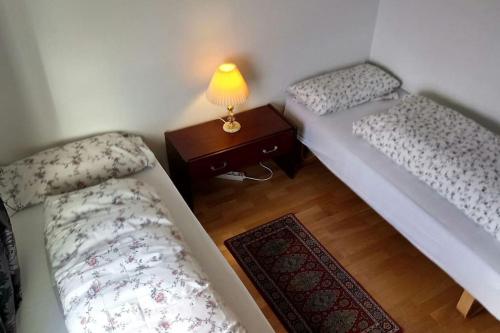 A bed or beds in a room at Lofoten Apartment + Rooms - Skrova