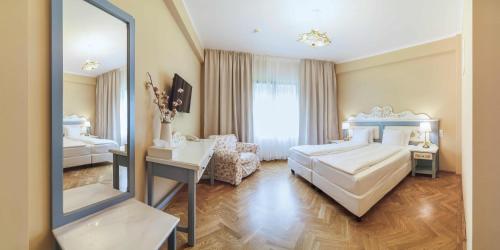 Кровать или кровати в номере Wolkendorf Bio Hotel & Spa