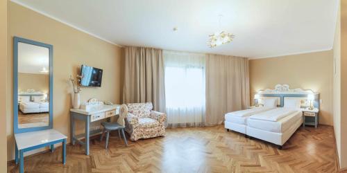 Кровать или кровати в номере Wolkendorf Bio Hotel & Spa