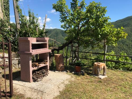 a brick oven sitting on top of a hill at Villa ELENA in Mezzanego