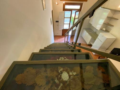 a group of stairs with a painting in the middle at Agriturismo Tenuta Badia in Paciano