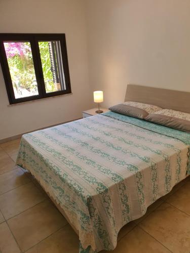 מיטה או מיטות בחדר ב-Nel Cuore di Campomarino
