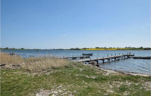 a dock in the middle of a large body of water at Awesome Home In Kerteminde With Wifi in Kerteminde