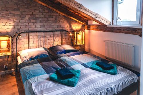a bedroom with a bed with two pillows on it at Das Sterf in Willershagen
