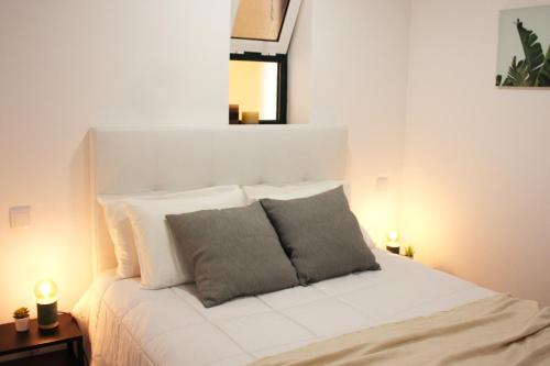 Säng eller sängar i ett rum på Easy4Stay by Beach Resort