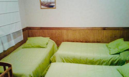 Katil atau katil-katil dalam bilik di Hostal Chalet Las Violetas