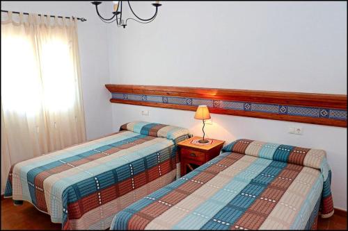 Ένα ή περισσότερα κρεβάτια σε δωμάτιο στο Apartamento Goya 7