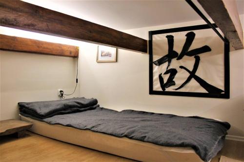 a bedroom with a bed and a painting on the wall at PrivOffice4U Samurai - Old Town, Main Square, Main station in Krakow