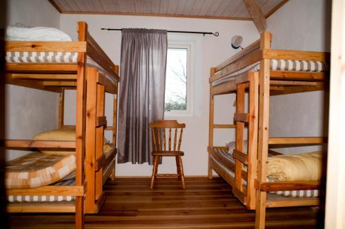 Postel nebo postele na pokoji v ubytování Nickarve Gård Hejdeby