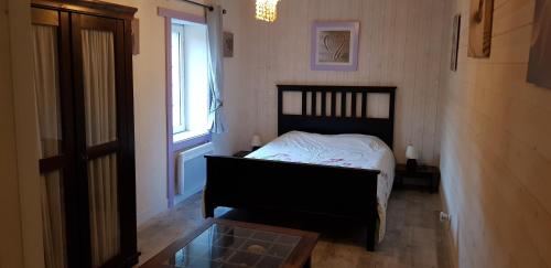 Ένα ή περισσότερα κρεβάτια σε δωμάτιο στο GITE TI - LIBELLULE