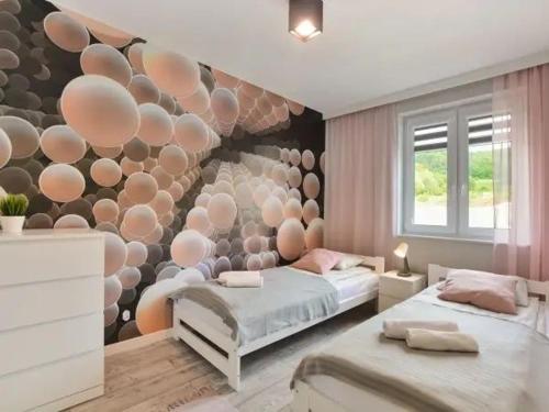 Posteľ alebo postele v izbe v ubytovaní Apartament Wiktoria
