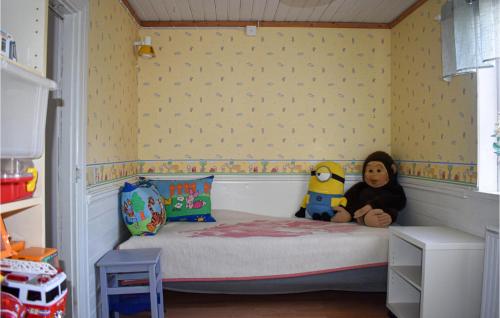a childs bedroom with a bed with stuffed animals on it at Awesome Home In Vittsjö in Vittsjö