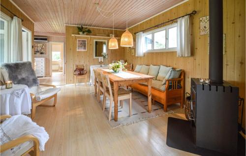 a kitchen and living room with a table and a couch at Amazing Home In Stubbekbing With Kitchen in Stubbekøbing