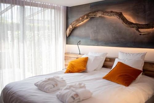 Cama o camas de una habitación en L'Ardenne Autrement Wellness include