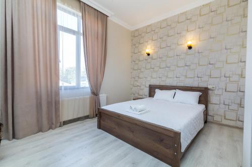Postel nebo postele na pokoji v ubytování White Hotel Guesthouse
