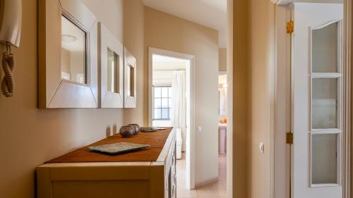 a kitchen with a wooden counter and a mirror at Maxorata in Morro del Jable