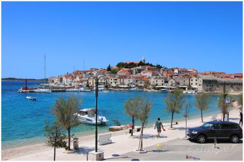 a view of a body of water with houses and boats at APARTMAN SMOLJIC 4+2 in Primošten