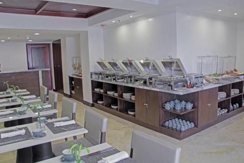 a restaurant with tables and chairs in a room at Intercontinental Real Guatemala by IHG in Guatemala