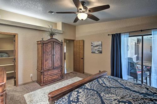 a bedroom with a bed and a ceiling fan at Heated Pool, Spa and Mtn Views Lake Havasu Home! in Lake Havasu City