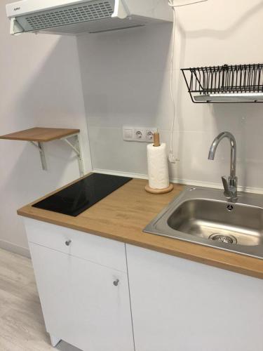 a kitchen with a sink and a counter top at Castro Sun And Beach in Castro-Urdiales