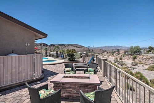 a patio with chairs and a table on a balcony at Heated Pool, Spa and Mtn Views Lake Havasu Home! in Lake Havasu City