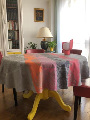 a table with a table cloth on it in a room at Beau studio Bastille in Paris