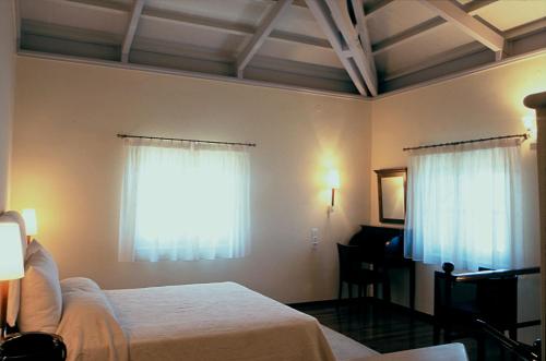 A bed or beds in a room at Villa Andromeda