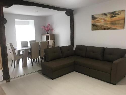 a living room with a couch and a table at Castro Sun And Beach in Castro-Urdiales