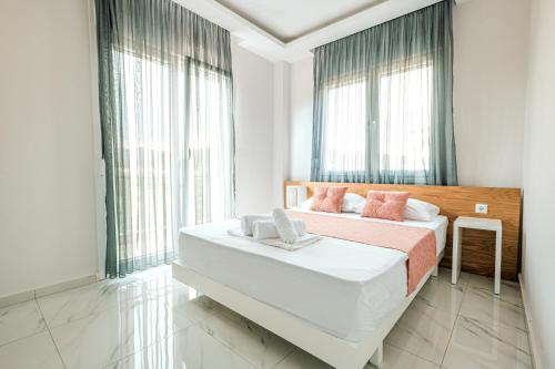 Postel nebo postele na pokoji v ubytování Design Suites Efharis (Brusco)