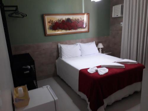 Tapindaré Hotelにあるベッド