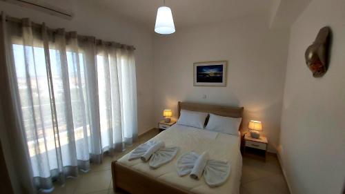 Postel nebo postele na pokoji v ubytování Nikko's apartments Elafonisos