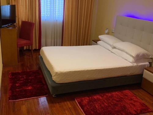 Una cama o camas en una habitación de Hotel Valenca do Minho
