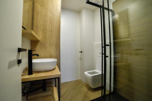 a bathroom with a sink and a toilet at Luxury Apartment Knezovic in Sinj