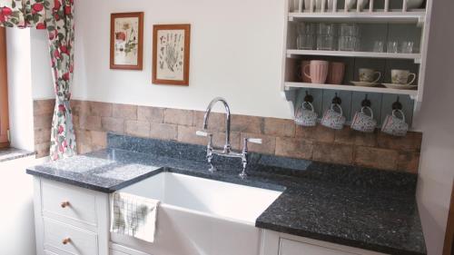 a kitchen with a sink and a counter top at Doubický Venkov in Doubice
