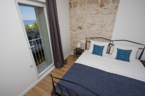 Postel nebo postele na pokoji v ubytování Apartmani Rustica