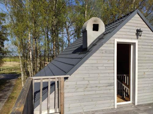 a small white building with a pitched roof at Srokowski Dwór 1 - Stara Kuźnia - Prywatna Sauna ! in Srokowo