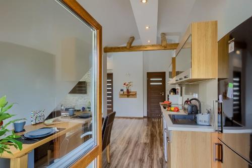 a kitchen with a sink and a counter top at Apartament Rynek in Tylicz
