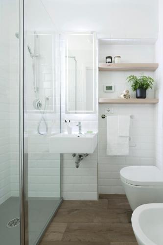 a bathroom with a shower and a sink and a toilet at Agriturismo Basegò in Venice