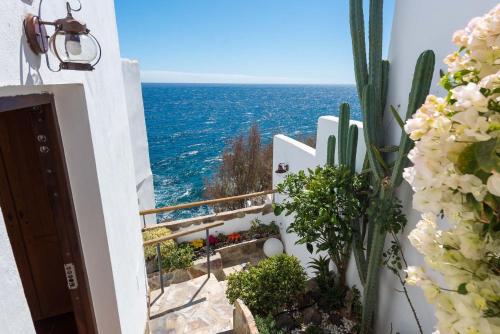 a view of the ocean from the balcony of a house at Luminous loft apartment next to the Atlantic Ocean in Radazul