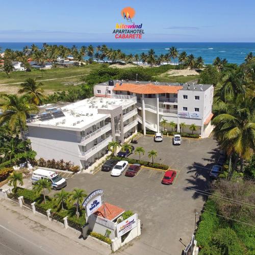 an aerial view of a hotel with a parking lot at Kitewind Apartamentos Cabarete in Cabarete