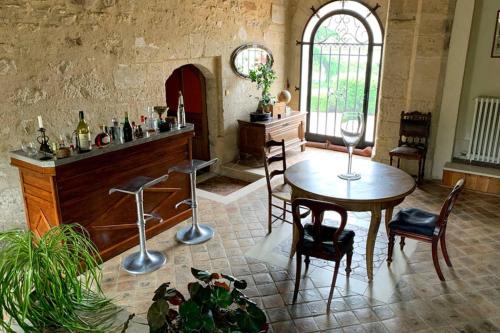 a room with a table and chairs and a window at Beautiful country house located 50min from Paris Eiffel Tour - Demeure d'exception à 50min de Paris Tour Eiffel in Hodent