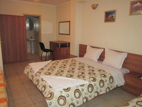 Ένα ή περισσότερα κρεβάτια σε δωμάτιο στο Versai Hotel