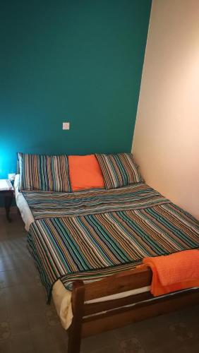two beds sitting next to each other in a room at Garden Bungalow Valentina in Stavros