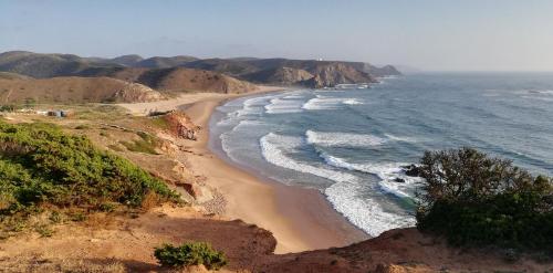 an aerial view of a beach with the ocean at Carrapateiramar Guest House in Carrapateira