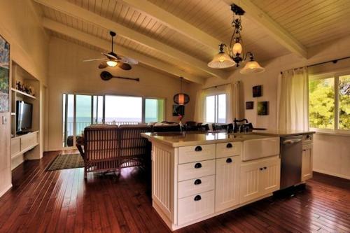 a large kitchen with a large island in the middle at THE JEWEL BOX home in Pahoa