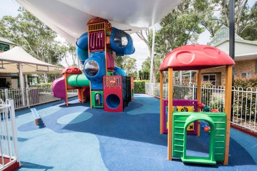 a playground with a slide and a play structure at Quality Inn Penrith Sydney in Penrith