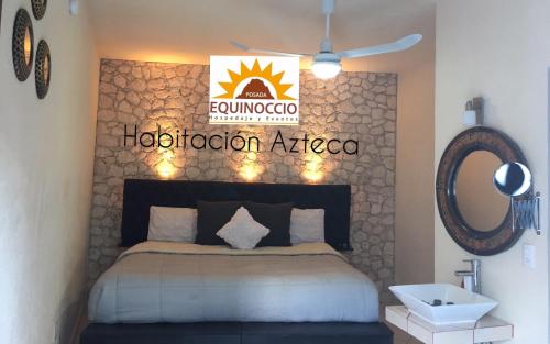 a bedroom with a bed and a mirror and a sink at Posada Equinoccio in Bernal