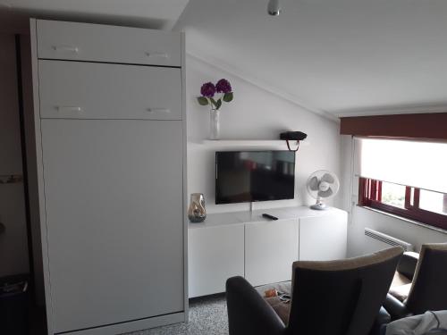 A kitchen or kitchenette at Ático tipo Loft centro de Mugardos